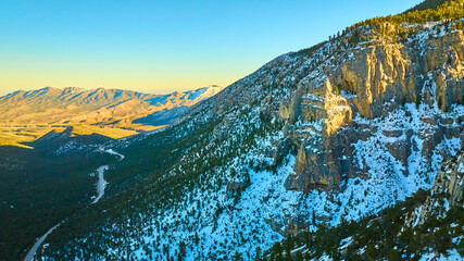 Aerial of Mt Charleston Snowy Peaks and Forest at Golden Hour