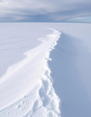 Fototapeta premium A pristine snowdrift, untouched, on a vast icy plain, winter, texture