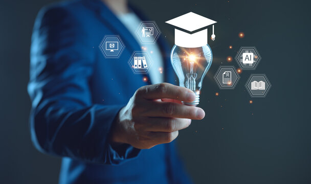 E-learning graduate certificate program concept. Man holding lightbulb showing graduation hat, Internet education course degree, study knowledge to creative thinking idea and problem-solving solution