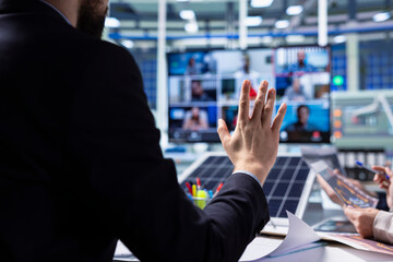Solar panels factory shareholders doing strategic planning during online videocall. Photovoltaics plant executives analyzing technical data during remote teleconference meeting