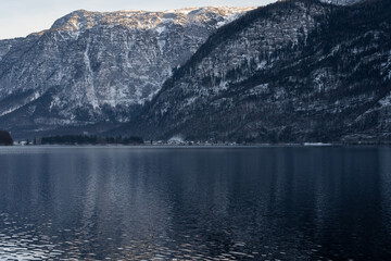 Bright sunny winter day, Alps, Hallstatt lake and village view.