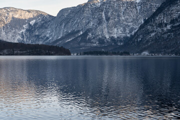 Bright sunny winter day, Alps, Hallstatt lake and village view.