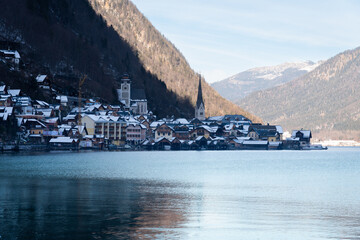 Bright sunny winter day, Alps, Hallstatt lake and village view.