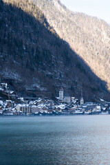Bright sunny winter day, Alps, Hallstatt lake and village view.