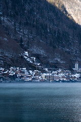 Bright sunny winter day, Alps, Hallstatt lake and village view.