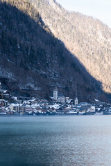 Bright sunny winter day, Alps, Hallstatt lake and village view.