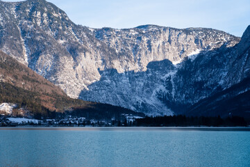 Bright sunny winter day, Alps, Hallstatt lake and village view.