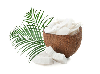 Coconut pieces and green palm leaves isolated on white