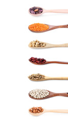 Spoons with different types of legumes isolated on white, set