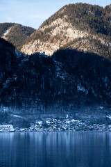 Bright sunny winter day, Alps, Hallstatt lake and village view.