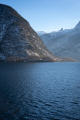 Bright sunny winter day, Alps, Hallstatt lake and village view.