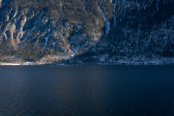 Bright sunny winter day, Alps, Hallstatt lake and village view.