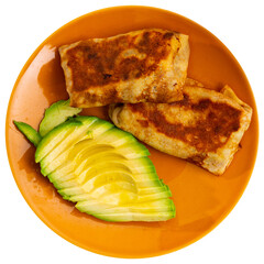 There are pancakes with meat filling on plate, supplemented with half chopped avocado. Isolated over white background