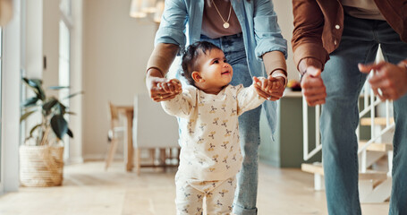 First steps, milestone or walking with parents and toddler in home for development or growth. Balance, learning or support with mom and dad teaching child how to move in apartment for motor skills