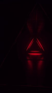 Abstract red futuristic background. Space from glowing neon light tubes of astera on black background. Technology, VJ concept. Tunnel interior view from a triangle. Led lamp. 3d loop animation 4K