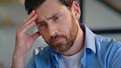 Closeup tensed employee thinking work crisis at workplace. Businessman pondering