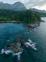 Rocky coastline with tropical forest in the background around Sabang, Palawan.