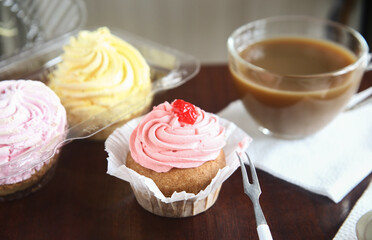 strawberry cake on a plate and cup of coffee
