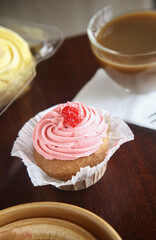 strawberry cake on a plate and cup of coffee