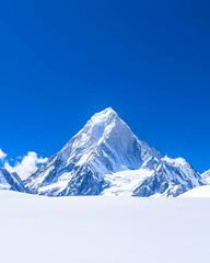 Majestic snow-capped peak under a vibrant blue sky