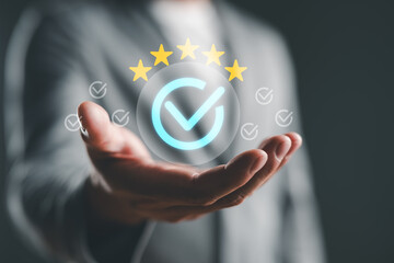 Businessman showing sign of the top service Quality assurance, Guarantee, Standards, ISO certification and standardization concept, Quality management with Quality Assurance, Quality Control. 5 star.