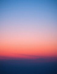 Fototapeta premium Soft blue twilight sky merging with warm sunset hues, ethereal and serene, tranquil, heaven