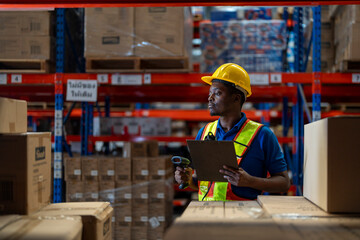 A team of engineers inspects the warehouse in a large storage warehouse. The inspection team uses...