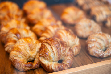 Showcase of traditional Spanish bakery shop with appetizing croissants