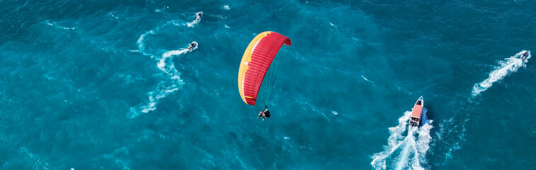 Paragliding in Thailand with blue sea. Two man paragliding high up in the sky. tourist attraction....