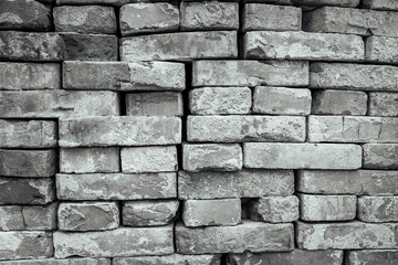 A stack of clay bricks.Material for construction.Background.
