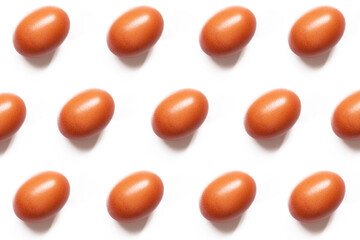 Seamless pattern of brown eggs on white background in symmetrical composition. Eggs lined up on light background. National Egg Day