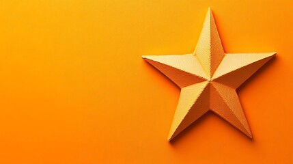 Obraz premium A golden star sits on an orange monochromatic background