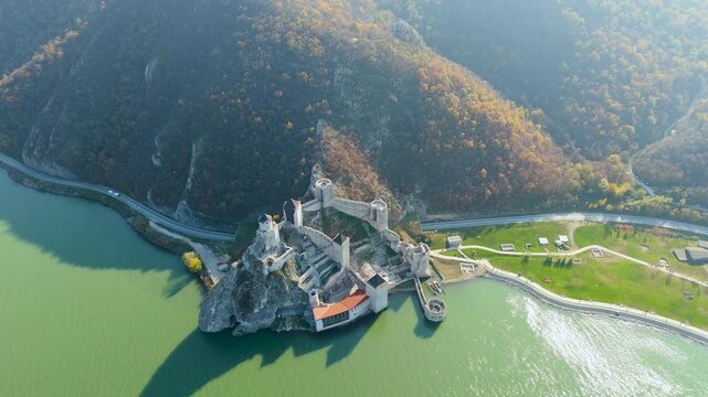 Embark on a mesmerizing aerial tour around Golubac Fortress. Witness dramatic rocky formations and the mighty Danube as the camera captures the stunning interplay of nature and history.