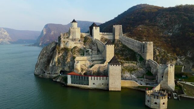 Embark on a mesmerizing aerial tour around Golubac Fortress. Witness dramatic rocky formations and the mighty Danube as the camera captures the stunning interplay of nature and history.