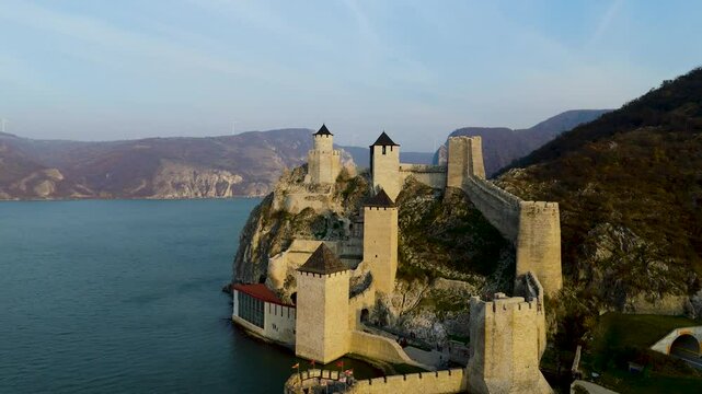 Embark on a mesmerizing aerial tour around Golubac Fortress. Witness dramatic rocky formations and the mighty Danube as the camera captures the stunning interplay of nature and history.