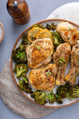 Oven roasted chicken with broccoli on a serving plate, easy sheet pan dinner or lunch idea
