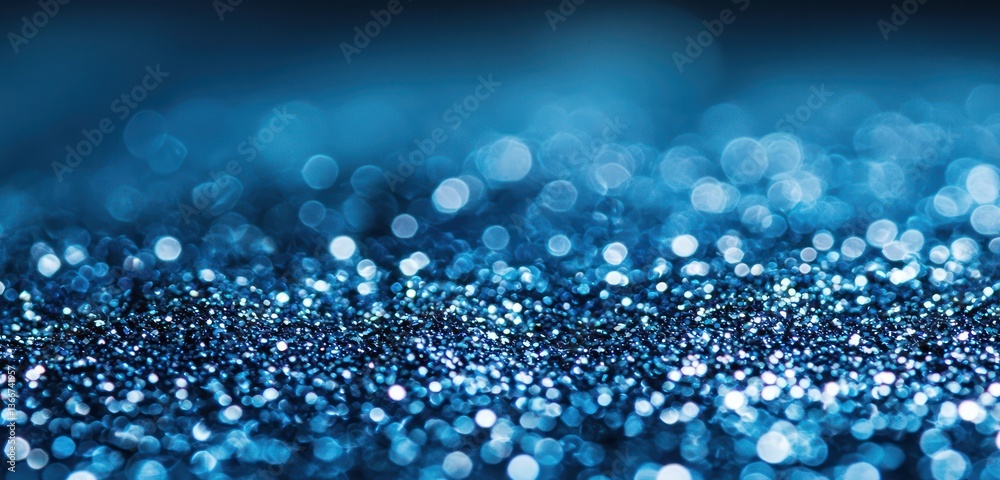 Wall mural glittering blue background with a soft, out-of-focus effect, adding depth and elegance to any design