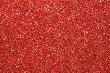 A red background with glittery red dots