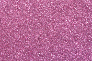 A pink background with glittery texture