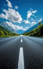 Fototapeta premium Driving Along Scenic Road with Mountain Views and Blue Sky