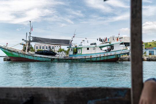 Old fishing boat with drying clothes, Lombok, Indonesia