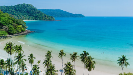 Experience the breathtakingly stunning landscapes and the mesmerizing turquoise waters of Koh Kood Island in Thailand, which serves as a perfect getaway embraced by lush greenery