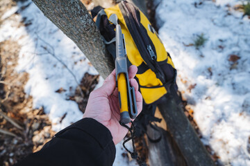 A person is firmly holding a bright yellow and sleek black tool in their hand, showcasing its importance and utility for various activities or tasks they might be involved in