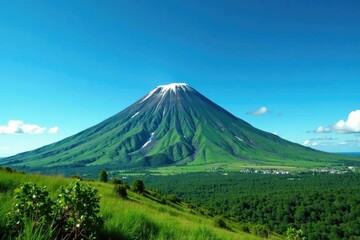 Fototapeta premium Majestic green volcano against a clear blue sky, majestic, volcanic peak, clear sky
