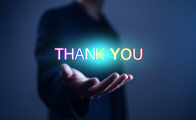 Businessman using laptop and showing thank you message. Concept of congratulation, appreciation, presentation from digital technology. Thank you in business and gratitude.
