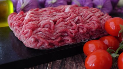 Cooking ground meat and fresh tomatoes for a delicious meal