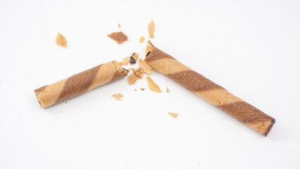 Cocoa filled wafer rolls with a crispy texture isolated on white background