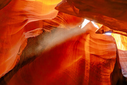 A masterpiece of nature, Antelope Canyon in Arizona, USA features smooth, vibrant sandstone walls illuminated by beams of sunlight, making it a photographer's paradise.