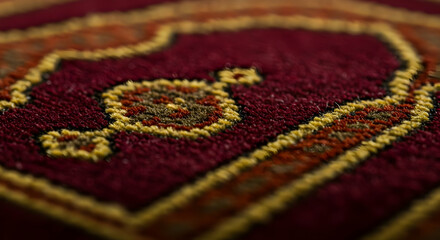 Fototapeta premium Detailed Closeup Of Woven Carpet With Red, Gold, And Brown Pattern