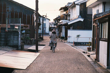[NARA]Area of historical buildings in Nara Prefecture, Nostalgic scenery, A person riding a...
